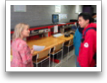 K. McConville speaks with a visitor.