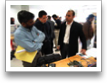 K. Umapathy listens to M. Bekhit explain his IR Data Kiosk.